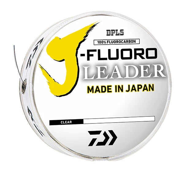 A spool of Daiwa J-Fluoro Fluorocarbon Leader Material with yellow and black branding, labeled as 100% Fluorocarbon, Made in Japan.
