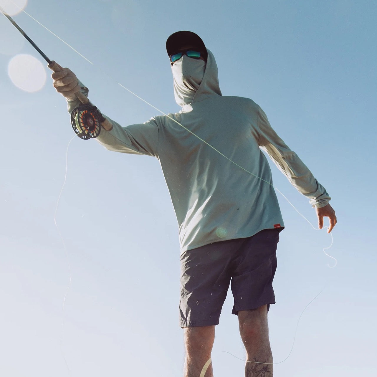 grundens-tough-sun-masked-performance-fishing-hoodie-iceberg-lifestyle-2