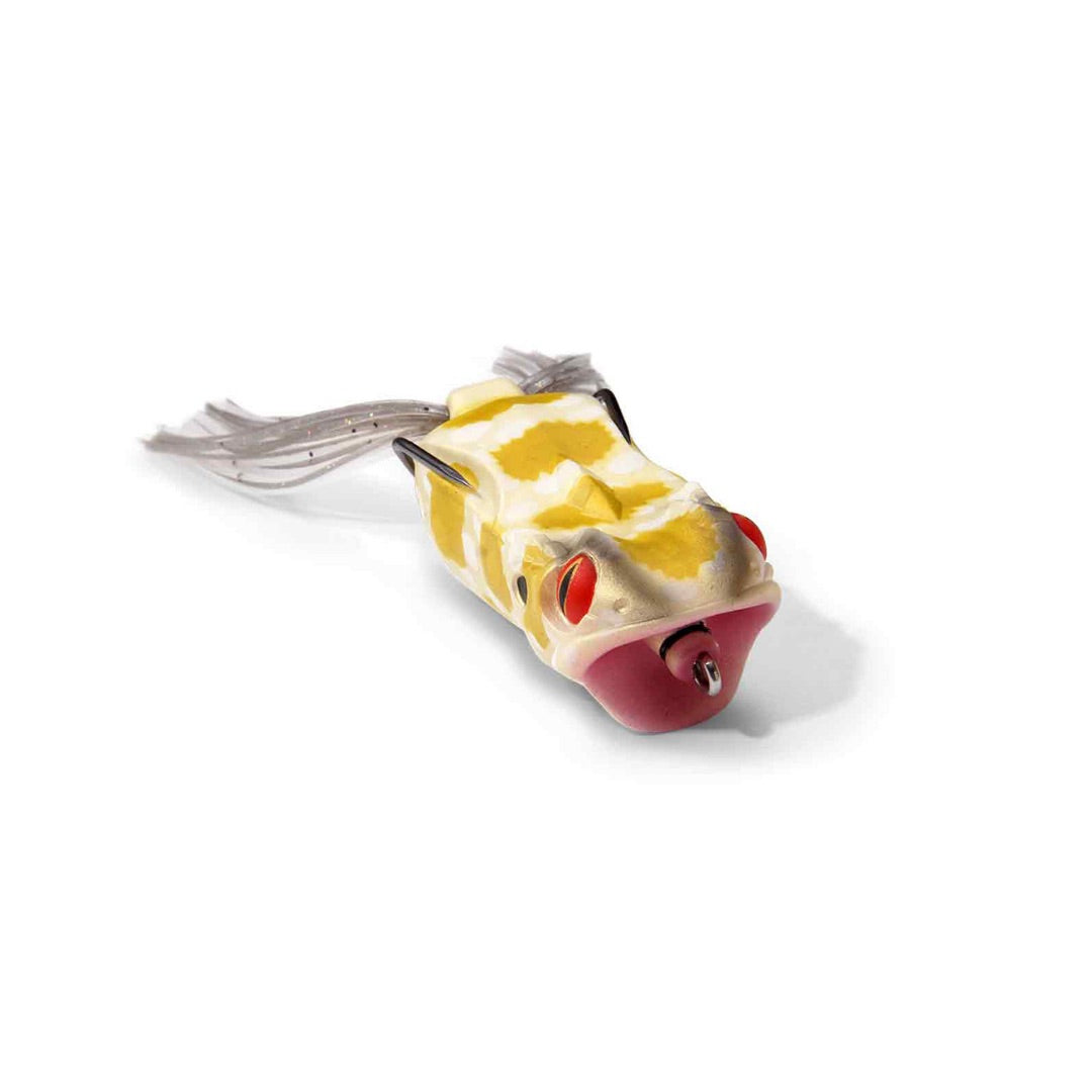 A frog-shaped fishing lure with a yellow and beige patterned body, red eyes, a red mouth, and a gray tail, shown on a white background.